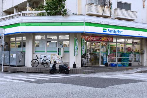 a scooter parked in front of a store at GEORGE HOUSE in Tsuji in Naha