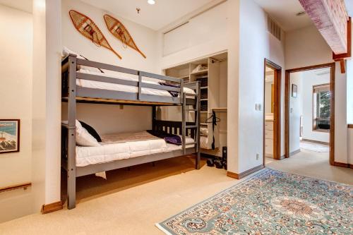 a bedroom with bunk beds in a house at Fawn Grove Deer Valley Lakeside in Park City
