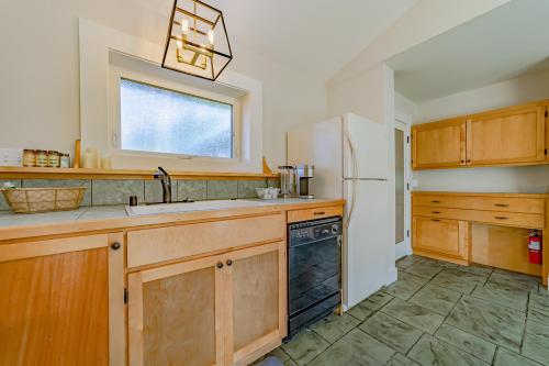 a kitchen with a sink and a refrigerator at The Pool House in Ferndale