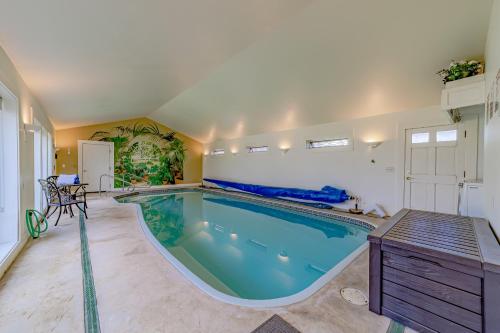 a large swimming pool in a room with a large at The Pool House in Ferndale
