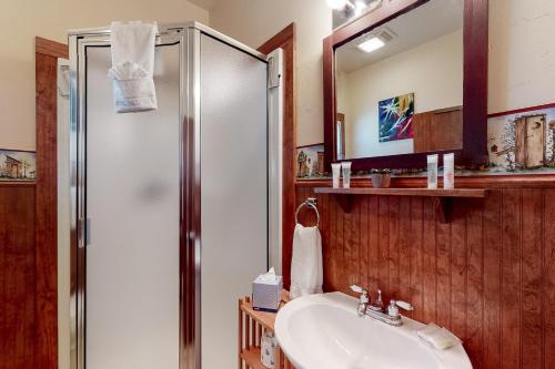 a bathroom with a shower and a sink at Sip & Stay in Fredericksburg