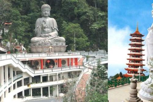 a building with a large statue and a building with a monument at CHARMING & COZY PREMIER SUITES @ VISTA RESIDENCE in Genting Highlands