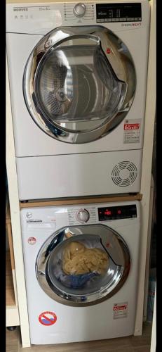 two washing machines stacked on top of each other at Vega - Free Parking - Self Checkin in Graz