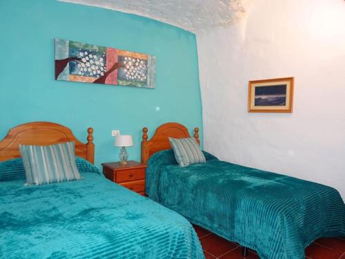 Postel nebo postele na pokoji v ubytování Casa de Abuela Petra