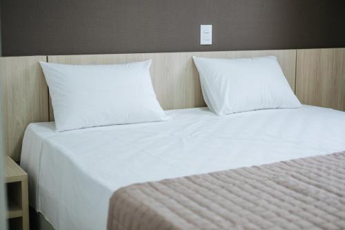 Postel nebo postele na pokoji v ubytování CALLAI HOTEL