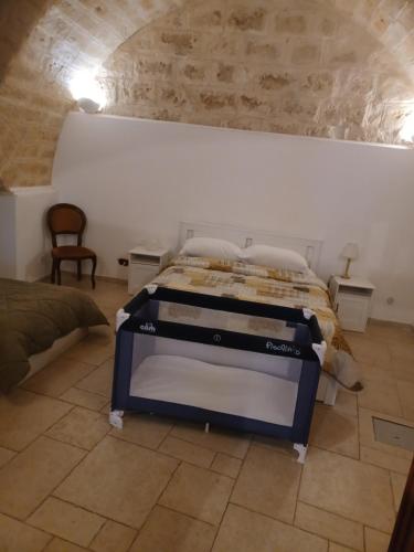a bed in a room with a stone wall at filioli apartment 2 in Bari