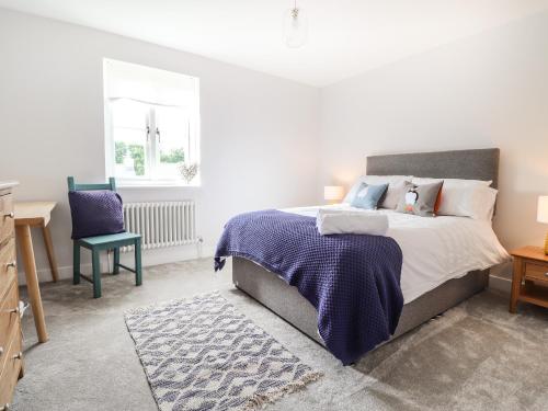 Un pat sau paturi într-o cameră la 4 Llain yr Eglwys