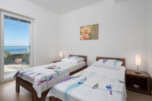 Posteľ alebo postele v izbe v ubytovaní Apartment Paradiso - Ravni