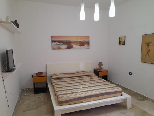 En eller flere senge i et værelse på Casa Rimar