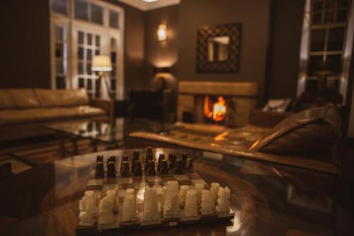 a living room with a chess board on a table at Haweswater Hotel in Bampton