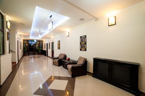 a living room with a couch and a fireplace at Pensiunea Montana Popa in Blaj