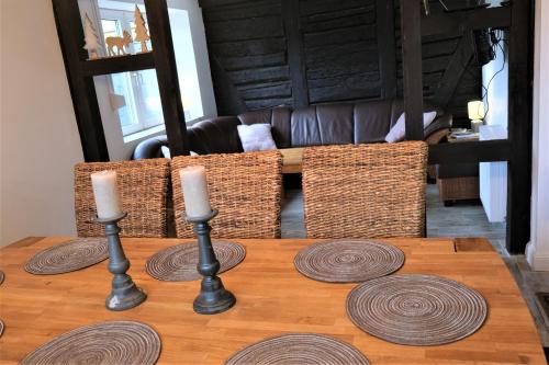 a table with two candles on top of it at Ursprüngliches Harzhaus für Aktive in Clausthal in Clausthal-Zellerfeld