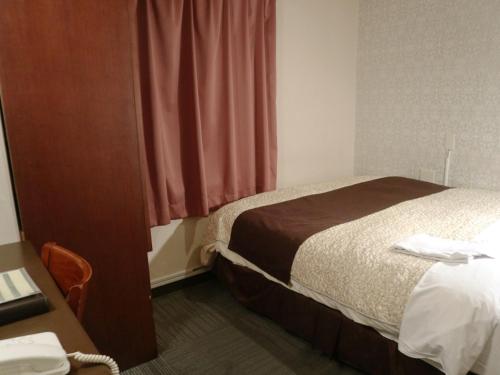 Hamamatsu Station Hotel - Vacation STAY 65842にあるベッド