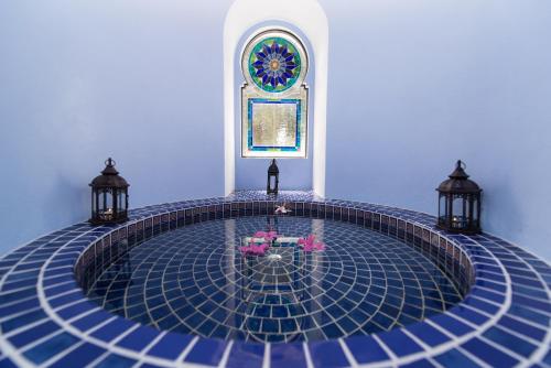 a pool in the middle of a room with two lights at Casa Estrella de la Valenciana Hotel Boutique in Guanajuato