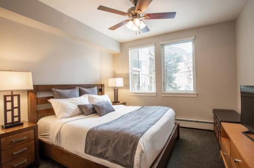 a bedroom with a bed and a ceiling fan at Beautiful Fraser Crossing Founders Pointe Condo with Upgraded Furnishings condo in Winter Park