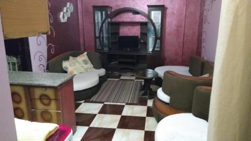 A seating area at App11- BELAL - Enjoy the privacy of staying in a quiet apartment with free Wi-Fi as your complete second home in the heart of Hurghada