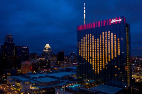 a tall building with a krispy kreme sign on it at Fairmont Austin Gold Experience in Austin