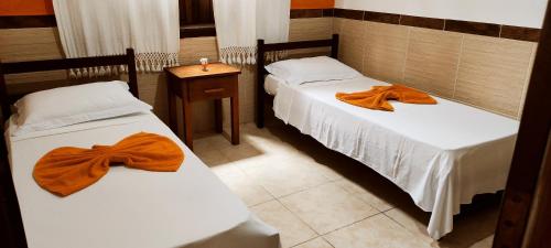 Ένα ή περισσότερα κρεβάτια σε δωμάτιο στο Apartamento Residencial Beija-flor