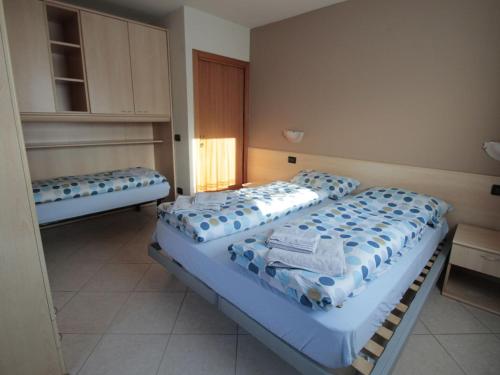 a room with two beds in a room at Brand new apartment in Livigno near ski area in Livigno