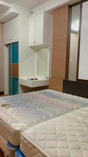 a bedroom with a large bed in a room at KTC TRADE CENTRE in Kota Bharu