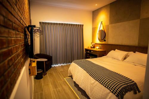 Ein Bett oder Betten in einem Zimmer der Unterkunft An-Ping Inn