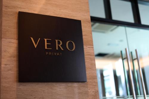 a sign for a vero pharmacy on a wall at Opero Hotel Southkey Johor Bahru in Johor Bahru