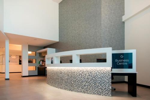 a lobby with a table with a sign that reads diabetes care at The Grand Winnipeg Airport Hotel by Lakeview in Winnipeg