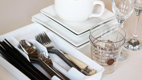 a white tray with silver utensils on a table at FIRST STREET Okinawa Yomitan-son Oceans -SEVEN Hotels and Resorts- in Yomitan