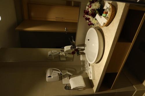 a bathroom with a toilet in a room at YN Hotels in Bengaluru