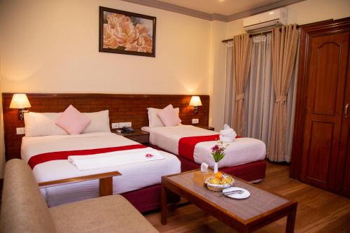 Postel nebo postele na pokoji v ubytování Hotel The White Lotus View Pvt Ltd