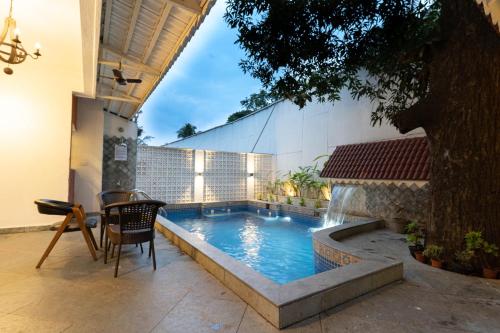 The swimming pool at or close to OV Private Pool Villas near Baga, I 4BHK units I Staff