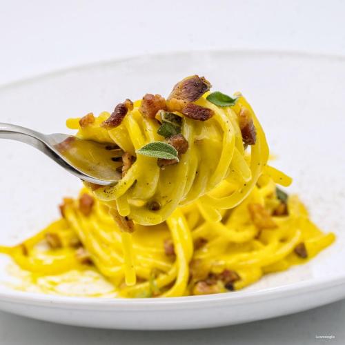 a plate of pasta with at Hotel Portavaldera in Peccioli