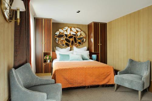 Letto o letti in una camera di Hôtel Baume