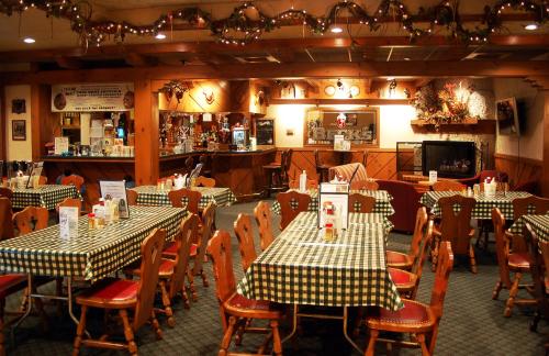 a restaurant with two tables and chairs with checkered tables at Bavarian Inn Lodge in Frankenmuth