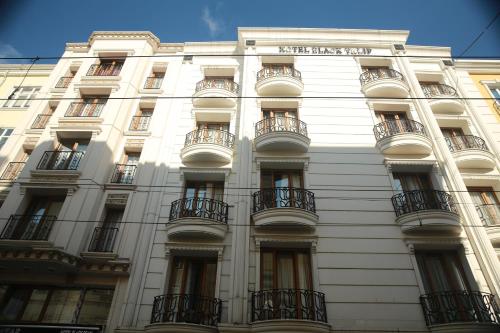 a white building with balconies on the side of it at Hotel Black Tulip in Istanbul