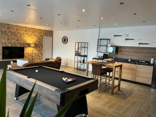 a living room with a pool table in it at Bleu Horizon in Quiberville