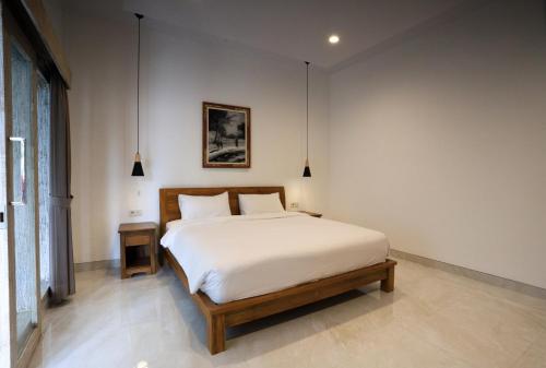 Ένα ή περισσότερα κρεβάτια σε δωμάτιο στο The Made Villa