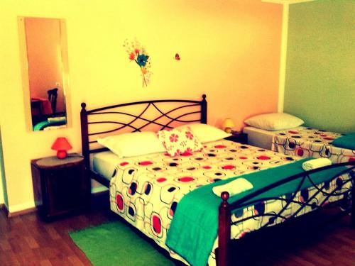 Katil atau katil-katil dalam bilik di Kaja House Apartments