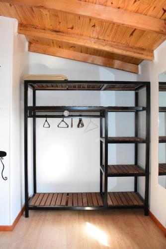 a loft bed with a desk in a room at Altos de Tolhuin in Tolhuin