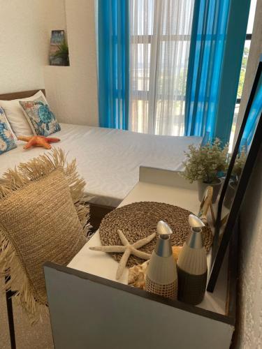 a bedroom with a bed with starfish and a table at REEF HOUSE BACNOTAN White sand beach front with Private Swimming pool in Bacnotan