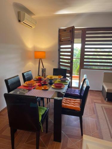 a dining room with a table and chairs at PANTELI APART HOUSE in Aheloy