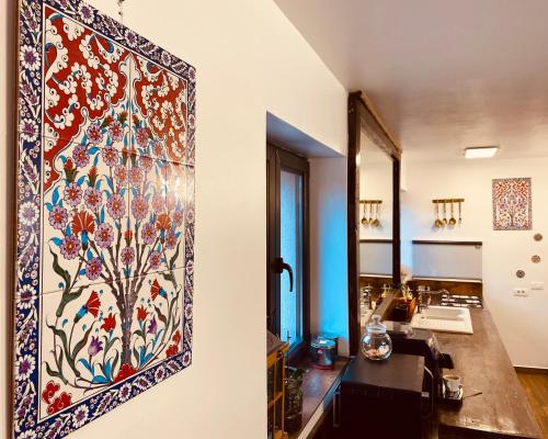 a tapestry hanging on a wall in a room at Casa Pisica Noastra in Breaza
