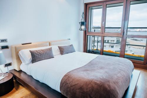 Postel nebo postele na pokoji v ubytování EL SEXTO DE LA PLAYA + PARKING GRATIS