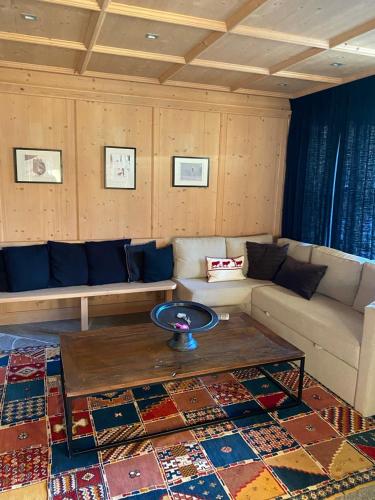 a living room with a couch and a table at ClubHotel Hinterthal Am Florysee 13 in Hinterthal