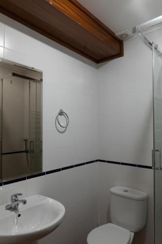 a bathroom with a toilet and a sink at Casa da Avó Alsira 2 in Évora