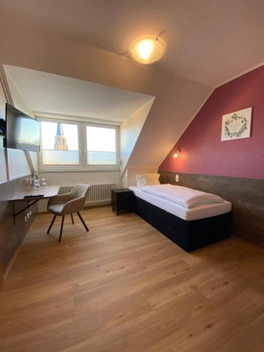 Postel nebo postele na pokoji v ubytování Hotel Schütz