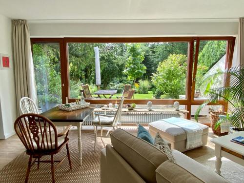 a living room with a couch and a table at Kleines Refugium in Bad Sachsa