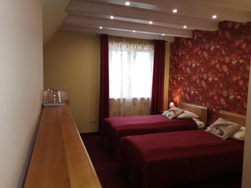 Postel nebo postele na pokoji v ubytování Hotel Senlīči