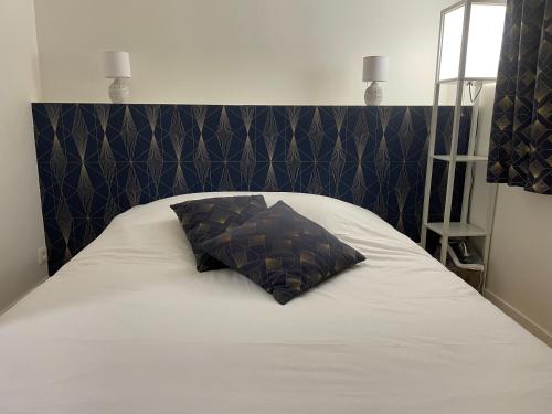 Voodi või voodid majutusasutuse Houlgate Appartement La Briarde toas