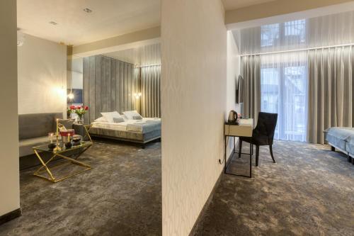 Postel nebo postele na pokoji v ubytování Hotel & Spa Biały Dom